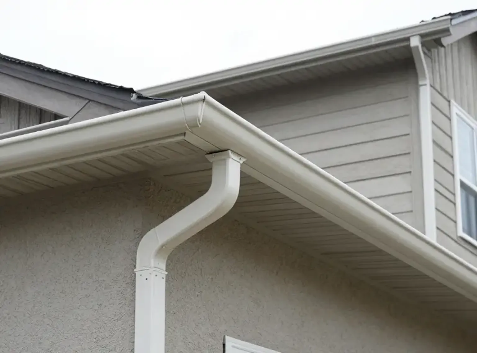 Gutter repair and reattachment completed on an American Fork Utah home with corrected slope and new hardware