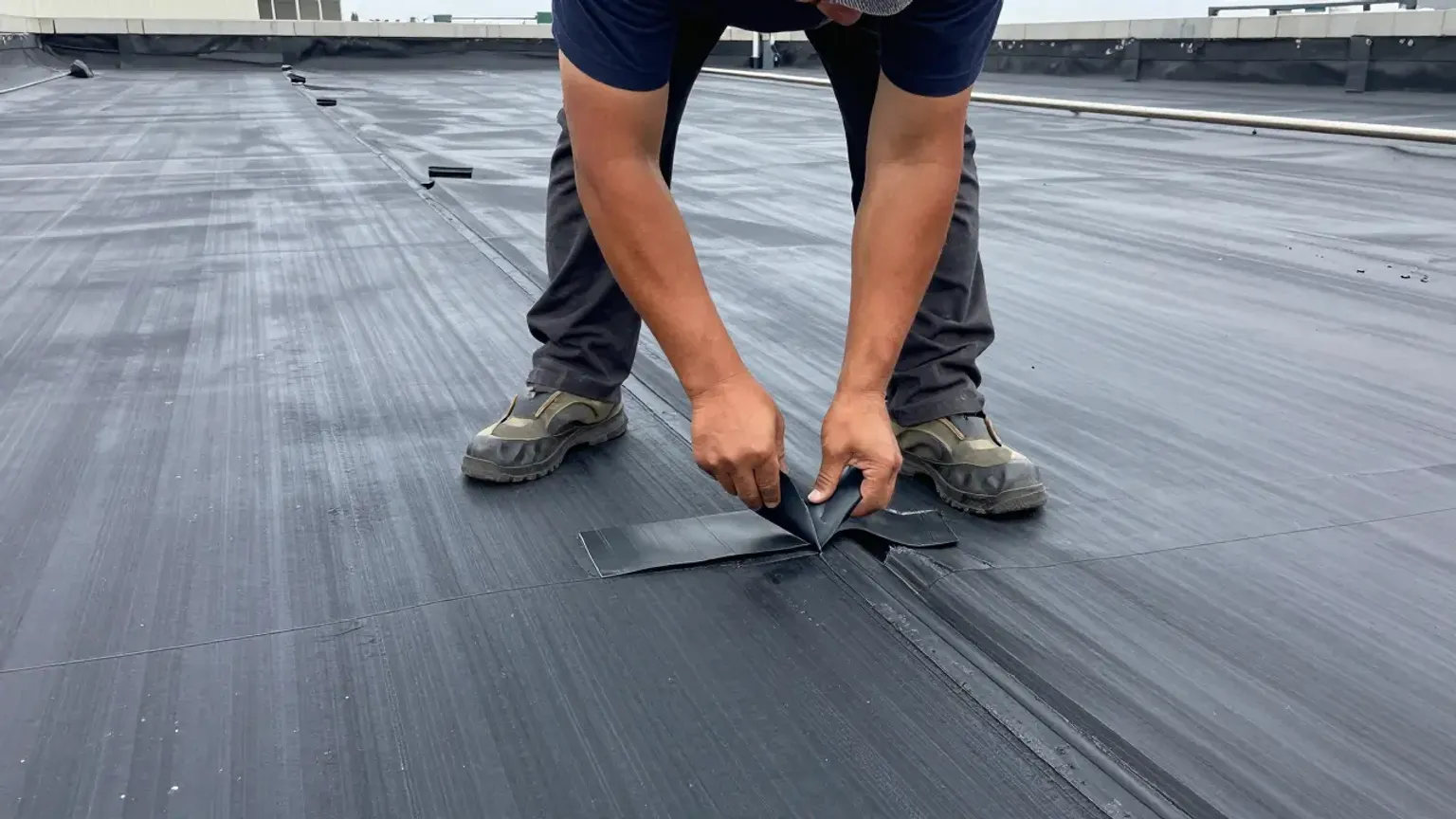Documentary-style iPhone photo of HVAC curb flashing repair on a commercial flat roof in Lehi Utah with membrane work visible